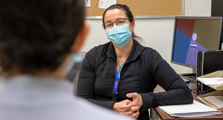 Dr. Erin Kennedy speaks with a patient.