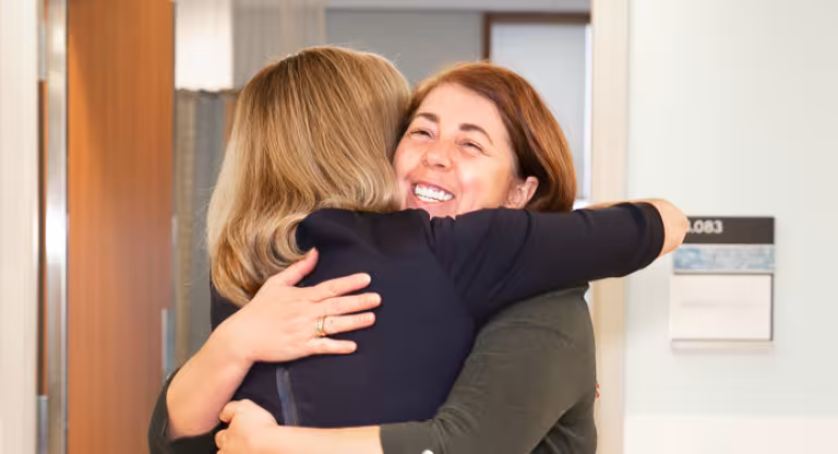Two women hugging
