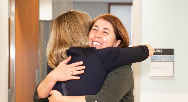 Two women hugging