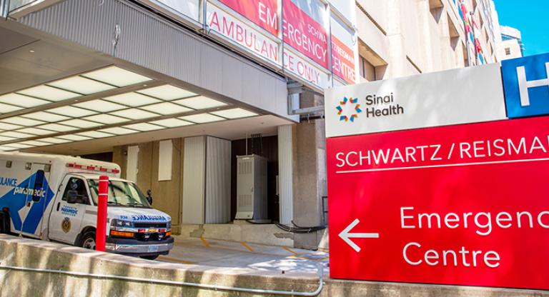 Entrance to Emergency Centre with ambulance vehicle in front