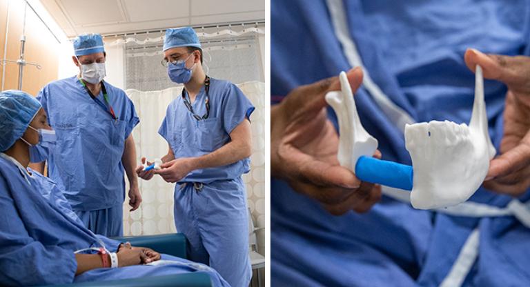 Photo of surgeons with patient who is all gowned up holding a 3D printed version of her jaw.