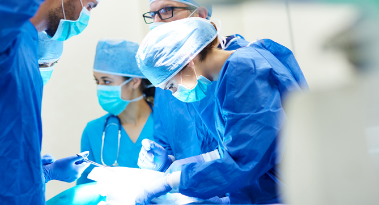 doctors performing surgery