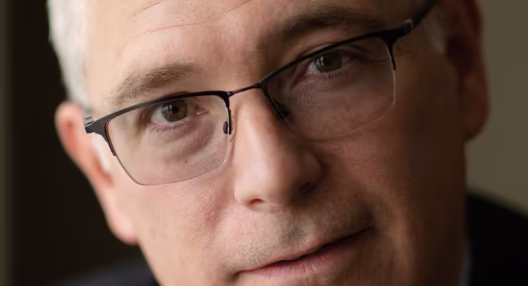 man wearing glasses. text in red box reads, "Krembil Foundation"
