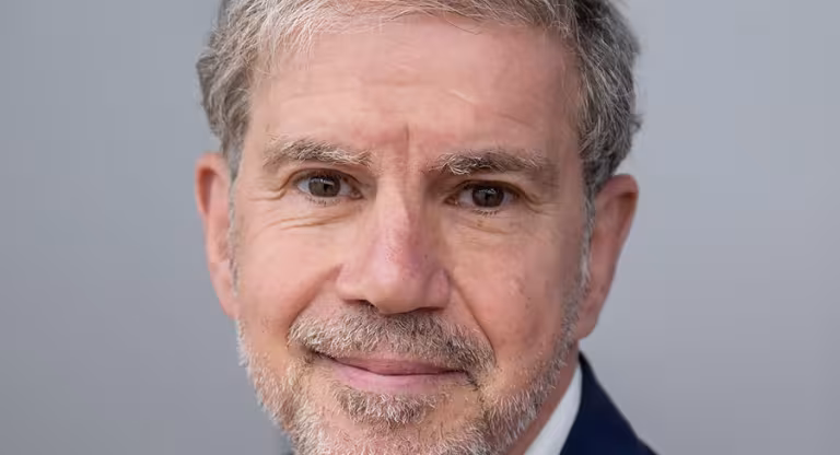 Man wearing dark blue suit