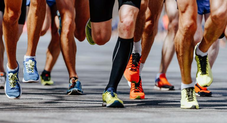 Legs of people running