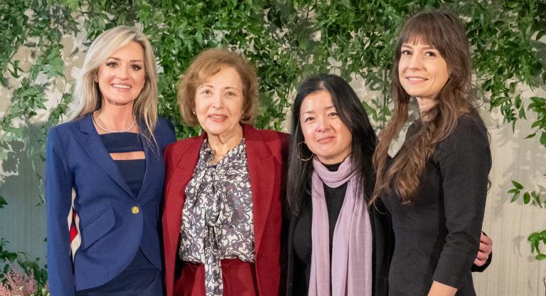 four women smiling