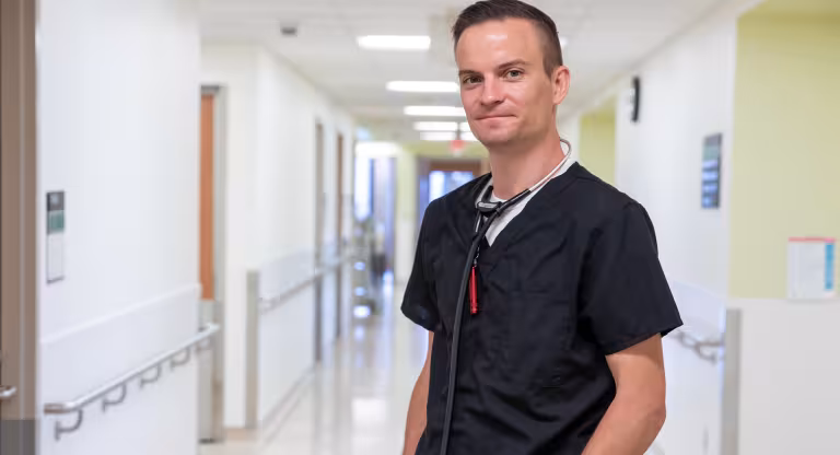 Kieran Quinn standing in a hospital hallway