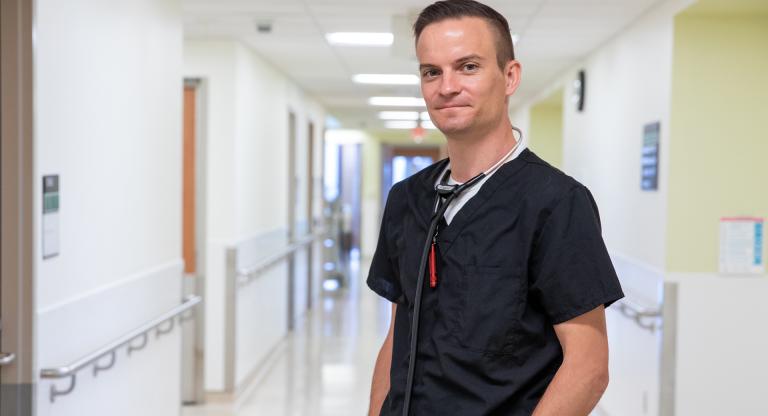 Kieran Quinn standing in a hospital hallway