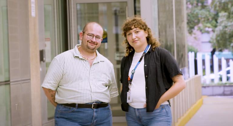 two people standing outside