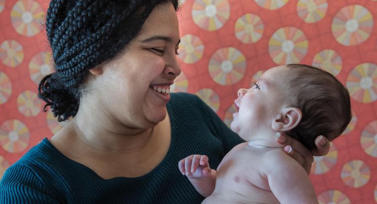 Mother, Grismaris, holding her baby boy, David.