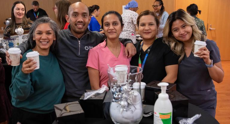 People celebrating together at Sinai Health’s Holiday Open House.