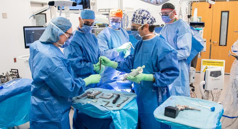 Members of the surgery team performing a procedure.
