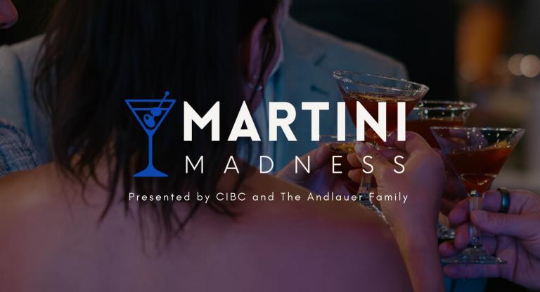 person holding a martini glass at a party