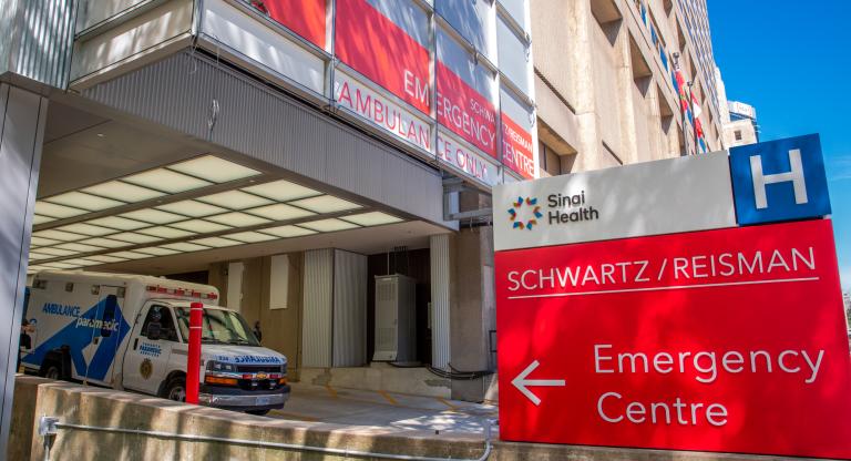 Ambulance parked outside the Emergency Department entrance at Mount Sinai Hospital in Toronto.