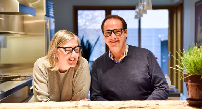 couple smiling in kitchen