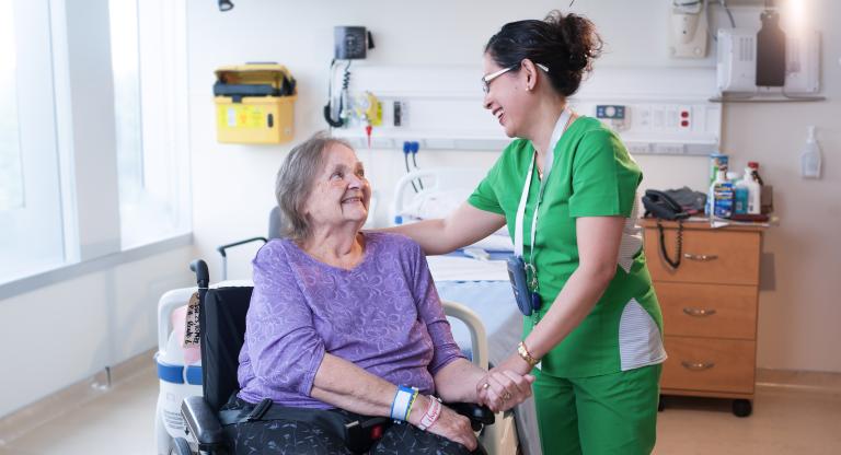 Health care worker with patient at Hennick Bridgepoint Hospital