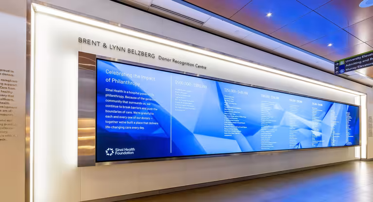 Large screen with lists of donors