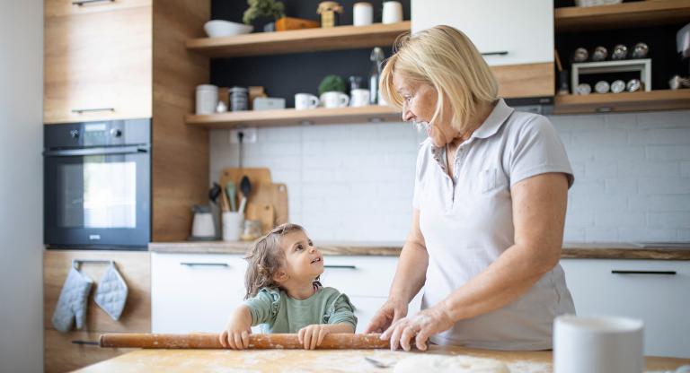 Grandmother baking with her granddaughter