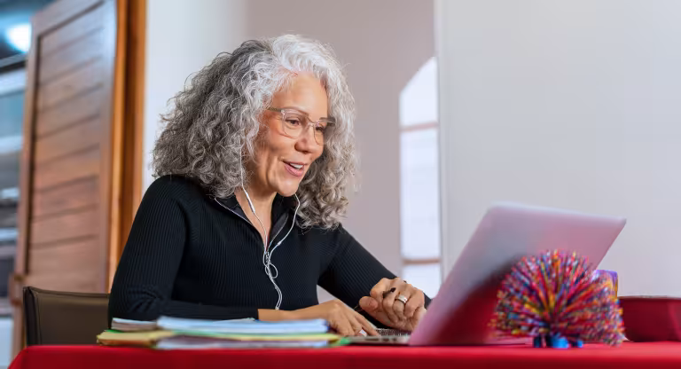 Older woman on a zoom call at home