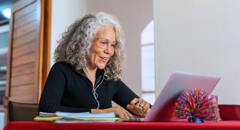 Older woman on a zoom call at home