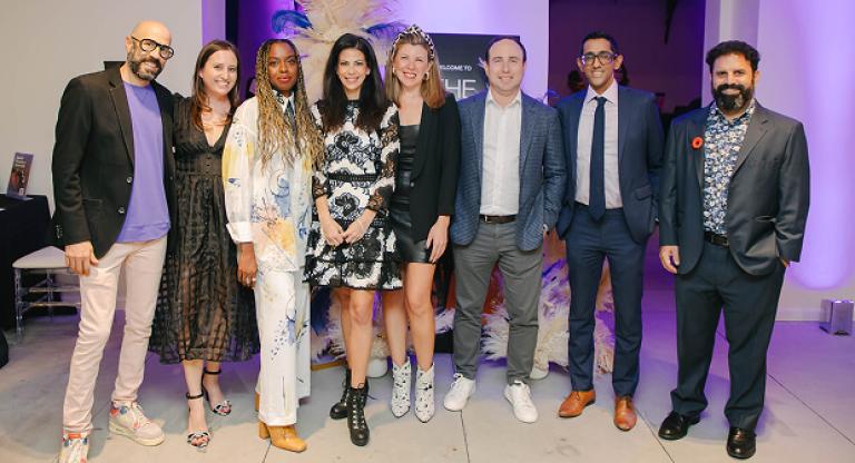 A group of young professionals, volunteers of Leadership Sinai, pose together at a Sinai Health Foundation event