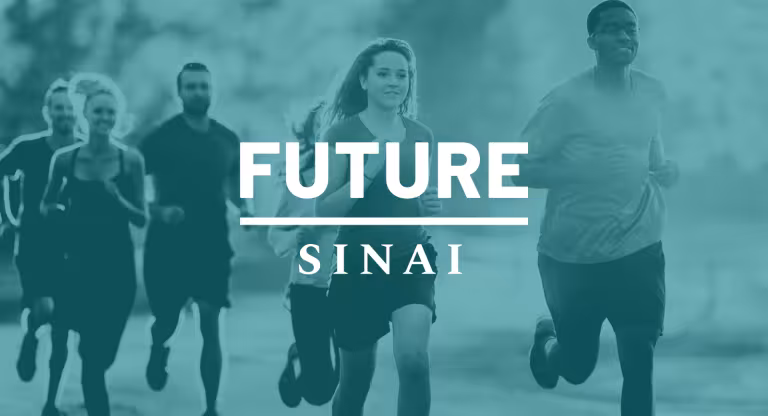 A group of six people running together outdoors, moving as a group for a run or fitness activity.