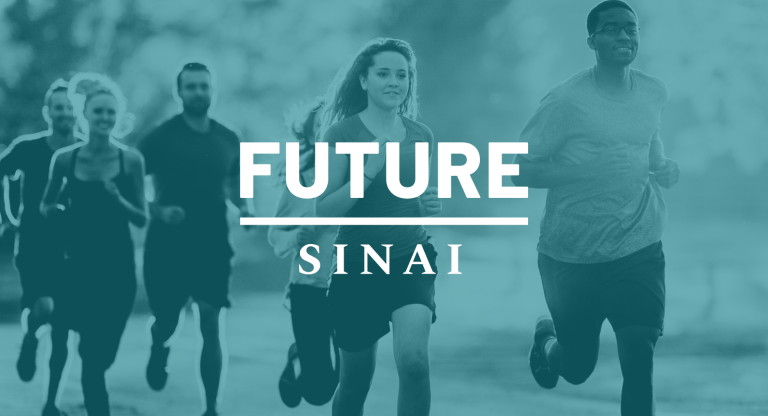 A group of six people running together outdoors, moving as a group for a run or fitness activity.