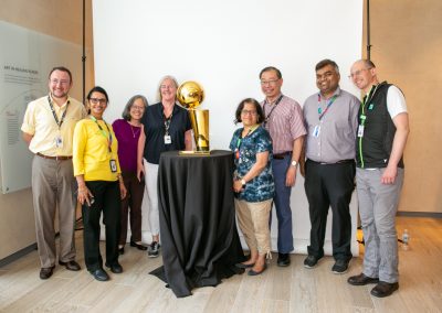 Employees with Larry O’Brien NBA Championship Trophy