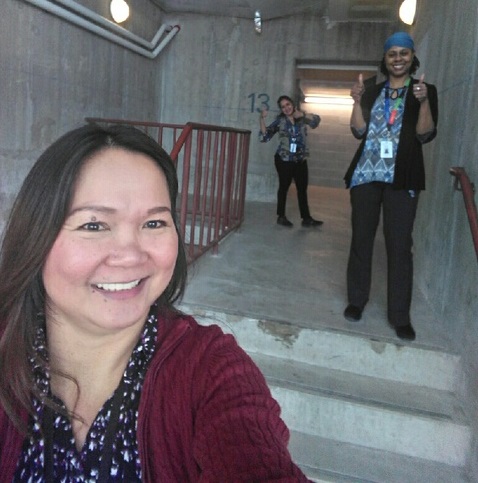 three hospital employees standing in a stairwell