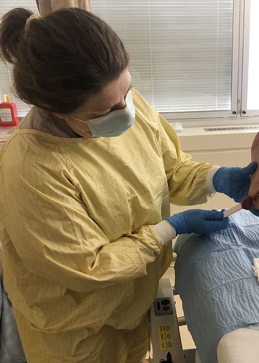 Nurse practitioner conducting research in wound prevention and treatment