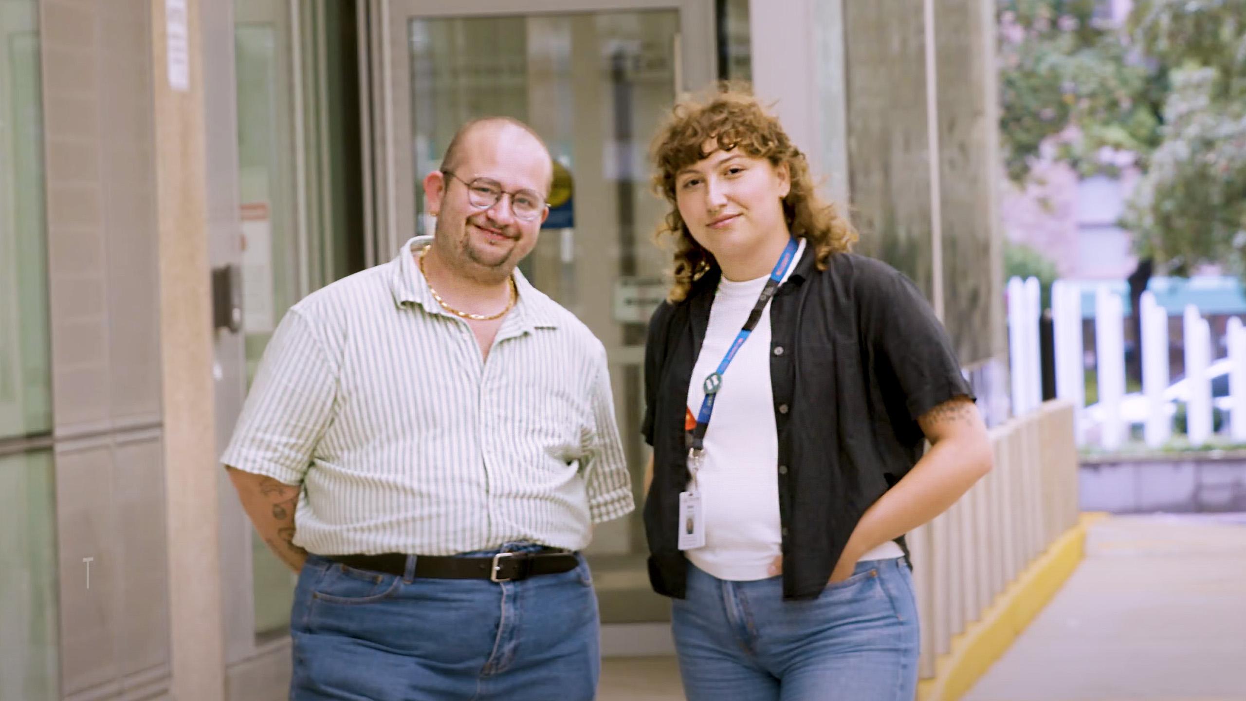 two people standing outside