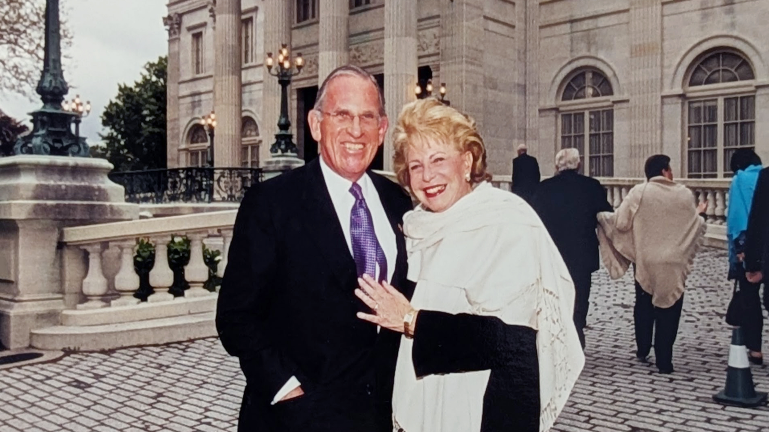 man and woman standing together outside